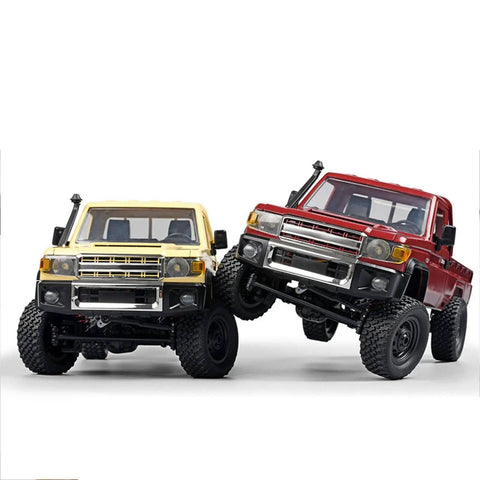 Two RC vehicles with metal chassis frames, one yellow and one red, demonstrating upgrades for 1/12 scale MN82 LC79 crawlers.