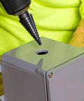 Step Drill Bit 14 Double Fluted 3/16 to 7/8 Inch with Easy Read Step Markings and Targets in use on metal sheet