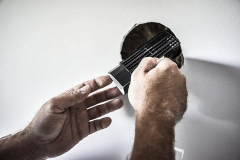 Applying High Strength Large Hole Drywall Repair Kit Includes Spackling Compound 12 Oz Spreader Sanding Sponge Hole Repair Plate And Tape