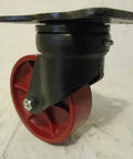 Heavy Duty 6 Inch Swivel Caster Drop Forged Kingpinless Rig Ductile Steel Wheel Handles 2000 Pound Loads side view showing black and red design