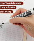 Hand using Scratch Fix Marker Pen For Wood Floors And Furniture, Quick Dry Filler Pen That Actually Stays Put, Black color