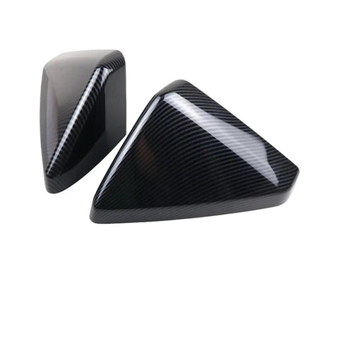 Hella Durable Matte Black Rearview Mirror Cover For 2024 Tesla Cybertruck shows two sleek mirror trim pieces in glossy carbon fiber finish.