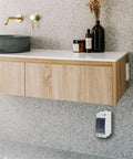 Installed Two Way Breaker Box Din Rail MCB Distribution Protection Box with transparent cover in a bathroom setting.