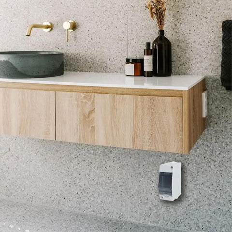 Installed Two Way Breaker Box Din Rail MCB Distribution Protection Box with transparent cover in a bathroom setting.