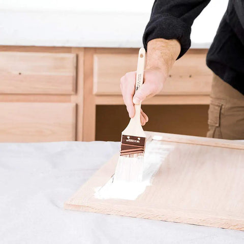 Applying Cabinet Coat Urethane Acrylic Satin Enamel Paint For Cabinets White 1 Gallon on wood with brush.