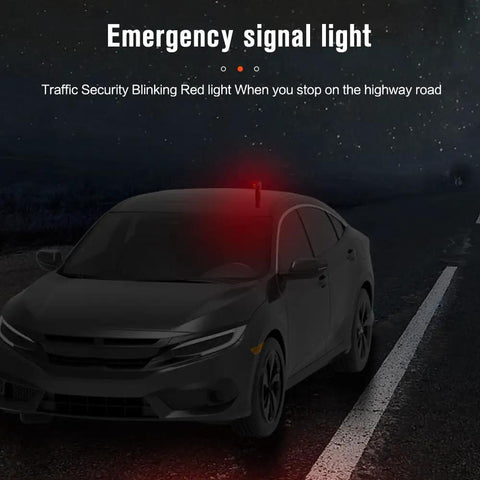 Emergency signal light on car roof with blinking red light for highway roadside safety at night.