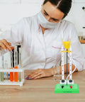 Scientist using Water Electrolysis Experiment Kit for home school lab with durable plastic electrolyzer apparatus.