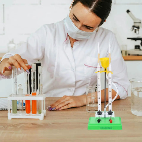 Scientist using Water Electrolysis Experiment Kit for home school lab with durable plastic electrolyzer apparatus.