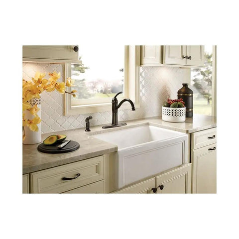 Braemore Mediterranean Bronze High Arc Kitchen Faucet With Side Spray Duralock Quick Connect One Handle Lever Easy Install Rich Dark Brown Finish For Classic Kitchen Cleaning And Modern Style with a view of kitchen sink area.
