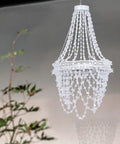 Give Your Outdoor Patio A Major Glow Up With This Stunning Handcrafted Solar Crystal Chandelier Featuring Cascading Diamond Sparkles And Weather Proof White Metal Frame, 40 inch height, white metal and crystal.