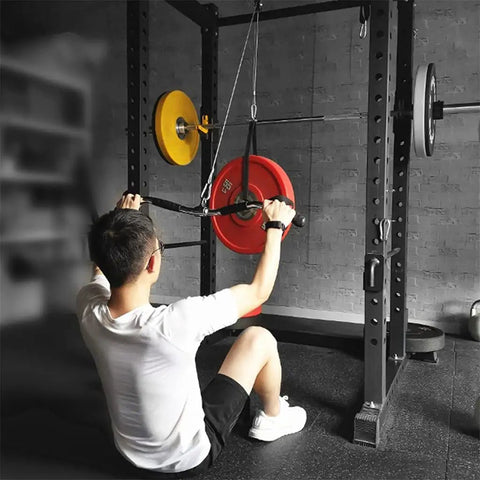 Man using Silent Cable Pulley System Dope Home Gym Attachments Heavy Duty Steel Lift Setup for arm workouts with power rack.