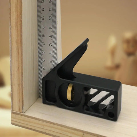 Professional Grade Carpentry Combination Square Layout Ruler With Dead On 45 And 90 Degree Marking measuring a wooden corner.