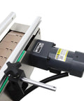 Top view of Fully Automatic Desktop Top And Side Labeler Machine With Adjustable Speed Control Fits Bottle Sizes From 1.57 To 3.9 Inches featuring motor and label feed.