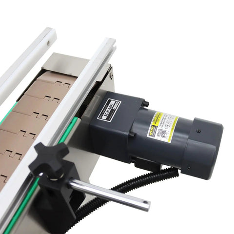 Top view of Fully Automatic Desktop Top And Side Labeler Machine With Adjustable Speed Control Fits Bottle Sizes From 1.57 To 3.9 Inches featuring motor and label feed.
