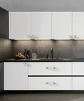 Brushed Satin Nickel Cabinet Pulls 4 Inch 102mm Hole Center Kitchen Cabinet Handles in a modern kitchen setting