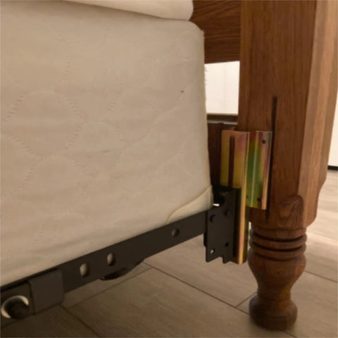 Top Shelf Galvanized Steel Bed Frame Conversion Brackets Four Pack installed on a bed frame, shown from the side angle with mattress.