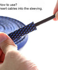 Hands inserting cable into 25 Foot One Quarter Inch Cable Management Sleeve Protector Expandable Braided PET Wire Loom