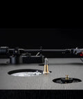 Close-up of the Dual CS429 Fully Automatic Belt Drive Turntable In Sleek Black showcasing tonearm and precise alignment.