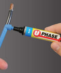 Hand using blue phase wire marker on exposed wire for Red Wire Marker Set With 7mm Tip For Electrical Panels And Circuits Four Pack For Quick Wire Labeling Up To 6 AWG Cat5 HDMI Auto Wire Color Coding For Easy Identification Pro Grade.