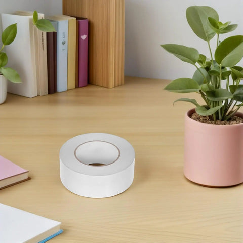 Slick Heavy Duty Double Sided Tape For Quick Fixes And Secure Mounting Reusable Transparent Adhesive Roll on wooden desk.