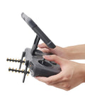 Yagi Antenna Booster for DJI RC2 and RC Pro2 screen controllers in use, black TPU and copper, extending Mavic 4 Pro flight range 30-50%.