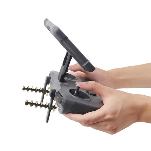 Yagi Antenna Booster for DJI RC2 and RC Pro2 screen controllers in use, black TPU and copper, extending Mavic 4 Pro flight range 30-50%.