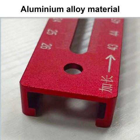 Close-up of 3 In 1 Router Grooves Bracket And Guide Kit in red aluminum alloy, showing ruler markings for precise fitting.