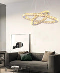 Modern 4-Ring Crystal LED Chandelier With Adjustable Height, K9 Crystal And Stainless Steel, Warm White 2700-3500K, Non-Dimmable above sofa