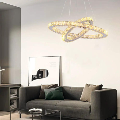Modern 4-Ring Crystal LED Chandelier With Adjustable Height, K9 Crystal And Stainless Steel, Warm White 2700-3500K, Non-Dimmable above sofa