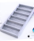 Clean Setup Six Slot Black Sunglasses Display Holder And Jewelry Organizer Box with soft gray fabric compartments.