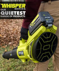 Bad Boy Cordless Leaf Blower Featuring A Smooth Brushless Motor That Runs Quiet While Cranking Out 160 MPH Winds For Tough Yard Work No Sweat Guaranteed Easy Setup Every Time Tool Only held by a person with fallen leaves in background.