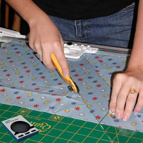 Person using 45mm Rotary Cutter Blades Pack Of 10 For DIY Quilting Sewing And Crafts on star-patterned fabric