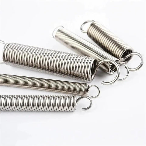 Close-up of 100 Piece Stainless Steel Extension And Compression Spring Kit With Hooks For Home Repairs, various sizes on white background