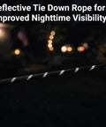 Reflective section of the 15 Ft Ratchet Strap Set With Paracord Tie Downs, 6 Pack For Tarps Tents And Canopies, at night