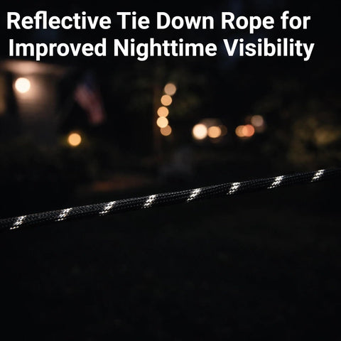 Reflective section of the 15 Ft Ratchet Strap Set With Paracord Tie Downs, 6 Pack For Tarps Tents And Canopies, at night