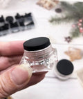 Kickass 115 Piece Silicone Hole Plugs Set With 10 Sizes T Style Rubber Stoppers, clear rubber grommet in hand.