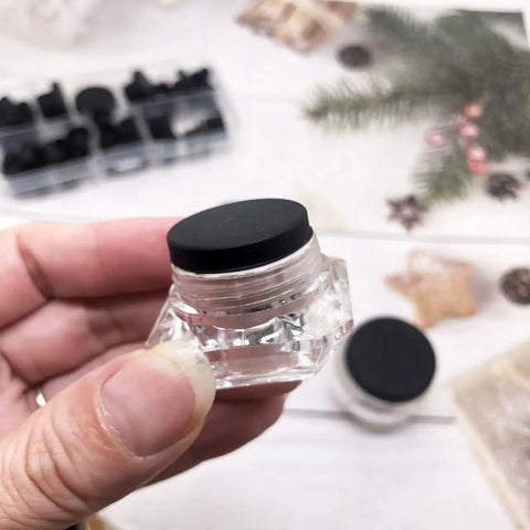 Kickass 115 Piece Silicone Hole Plugs Set With 10 Sizes T Style Rubber Stoppers, clear rubber grommet in hand.