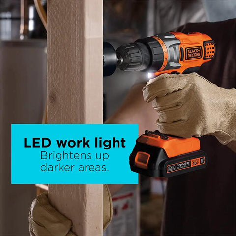 20V Max Cordless Drill Driver with Battery and Charger, LED Work Light in use, lighting up dark work area, gloved hand holding tool