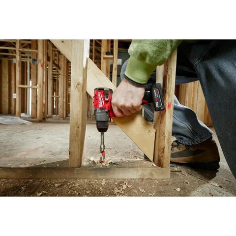 M12 Fuel Cordless Hammer Drill Kit delivering knockout torque used on wood framing with a drill bit for precise drilling