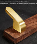 Straight Up Sturdy Five Hook Wall Coat Rack Designed For Hanging Daily Duds Hats Keys And Towels Helps You Keep Your Entryway And Bathroom Tidy With Easy Mounting Hardware Included, featuring a gold hook on a wooden base.
