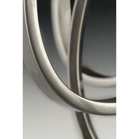 Close-up of brushed nickel finish on the Torino Three Light Bath And Vanity Fixture With Twenty Five Inch Width And Seven And Five Eighths Inch Height Brushed Nickel Finish For Modern Bathroom Lighting That Looks Sleek And Fresh And Ready To Elevate Your Vanity