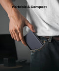 Person placing a portable hard drive into jeans pocket, demonstrating compact size for easy carrying.