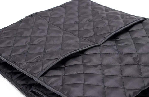 Close-up of black waterproof coffee maker cover for Keurig single serve brewers, dustproof no-fuss kitchen protector, quilted texture