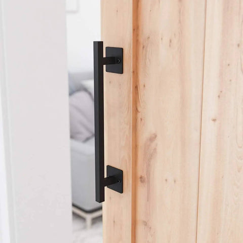 Antique Rustic Twelve And Five Eighths Inch Barn Door Handle on wood door, frosted black finish, square base