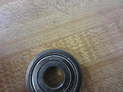 6200Z single-shielded deep-groove ball bearing 10 mm ID x 30 mm OD x 9 mm width component on wooden background