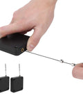 Hand holding PunchFree Portable Automatic Door Closer Sensor Two Pack For Home And Office Doors No Drill Adhesive Install unit