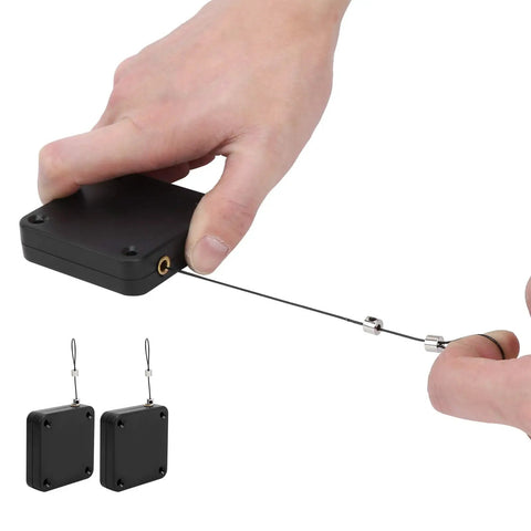 Hand holding PunchFree Portable Automatic Door Closer Sensor Two Pack For Home And Office Doors No Drill Adhesive Install unit