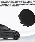 Universal 54 Mm Wheel Center Caps Snap In Rim Hub Covers Anti Scratch Dustproof Black Hubcaps shown installed on vehicle wheel rim.