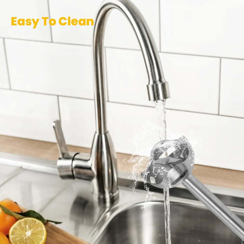 Rechargeable Cordless Immersion Blender With Sweet Egg Whisk Attachment under running water in a sink for easy cleaning.