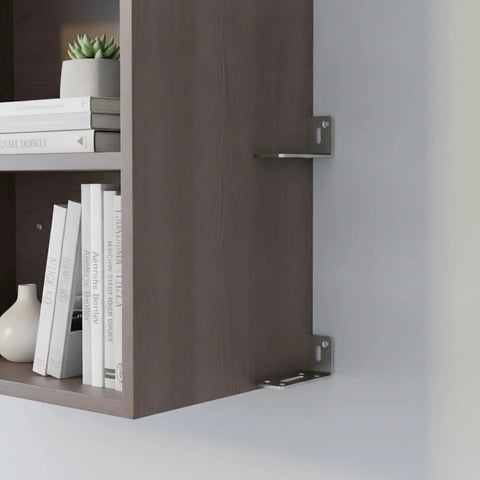 Sturdy 3.15 Inch Stainless Steel L Shaped Bracket Wall Mount for Floating Shelves Heavy Duty Right Angle Support Keeps Shelves Level and Secure for Books Decor Electronics mounted under a wooden shelf unit.